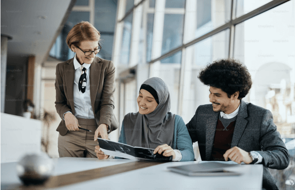 office workers discussing the content in a brochure